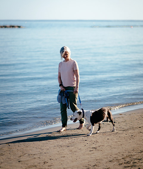 walking dog at beach