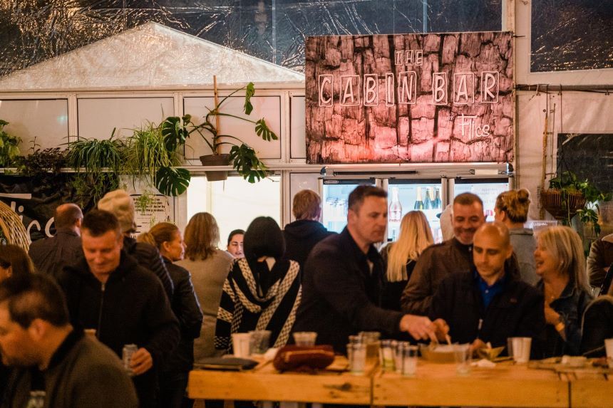 Group of people enjoying drinks at an outdoor venue