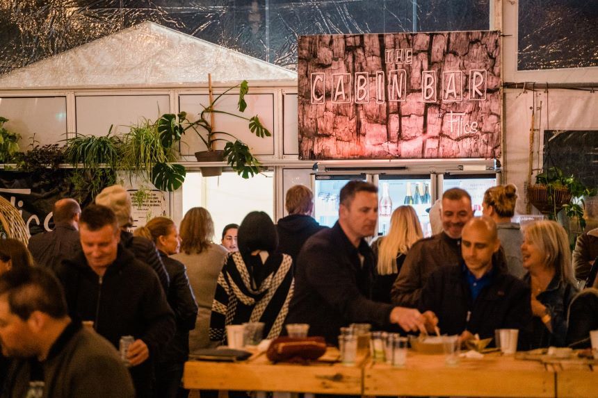 Group of people enjoying drinks at an outdoor venue