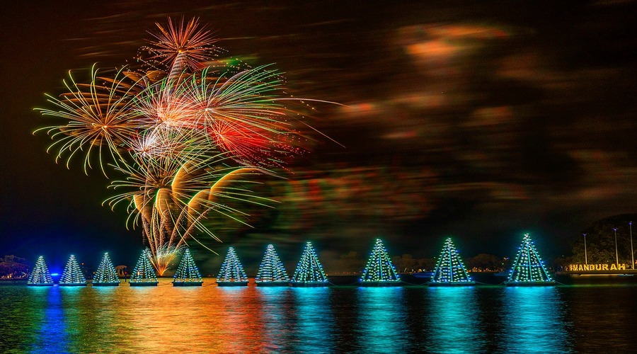 Fireworks on foreshore with lights