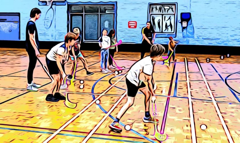 Abstract image of 6 children and 2 coaches practising floorball drills on an indoor court