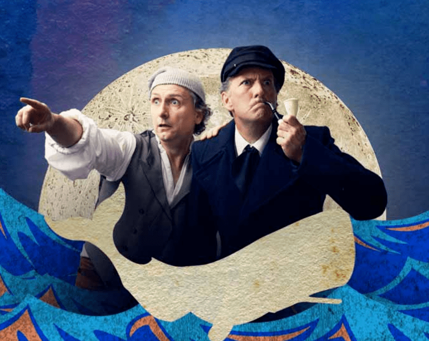 Comedians Lano and Woodley with a painted moon and sea packground