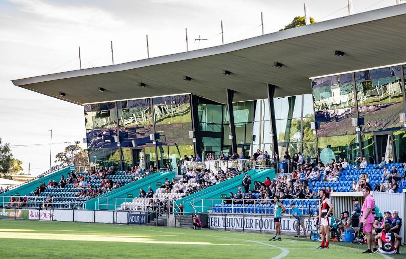 Spectators in the stands of David Grays Arena watching an AFL match