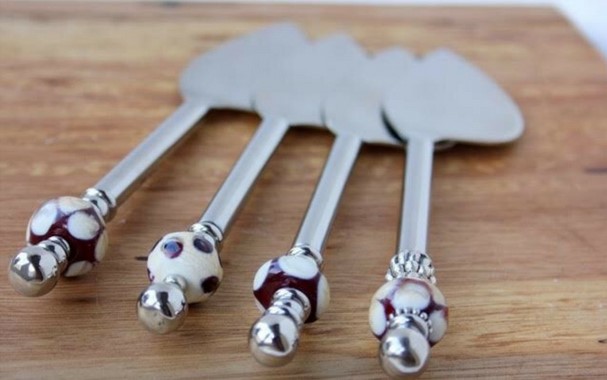 Decorated cheese knives by Cindy Wright