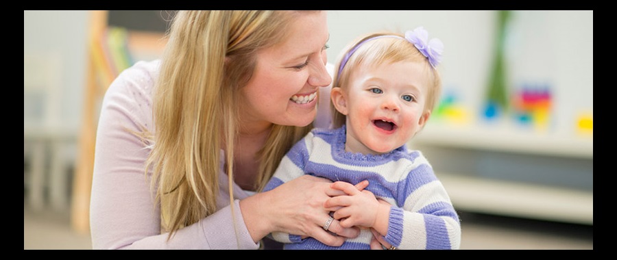 Mother and daughter Mother tickling and laughing with her toddler daughter