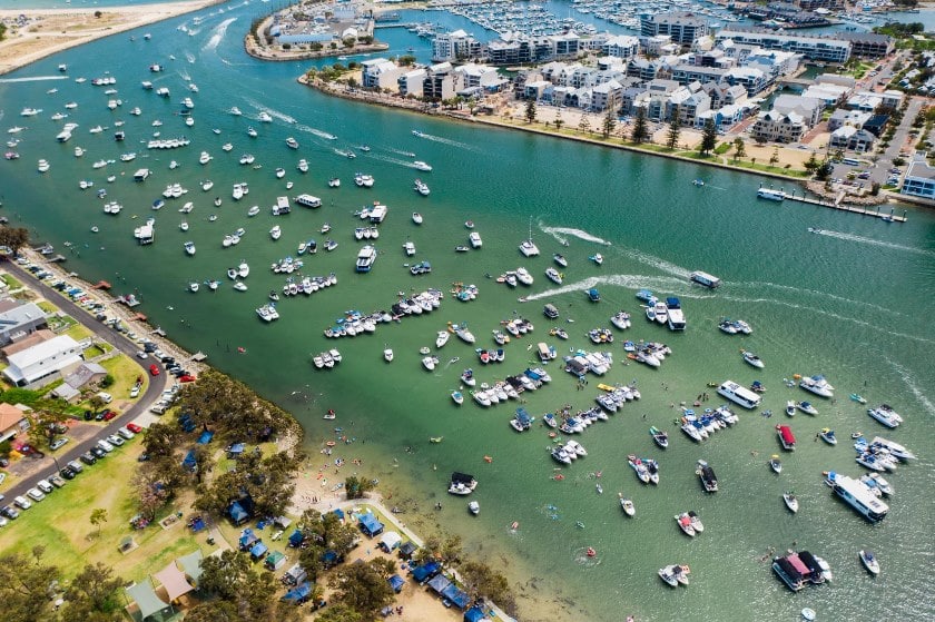 Aerial photo of large number of boats in the estuary for the Australia Day Flotilla event