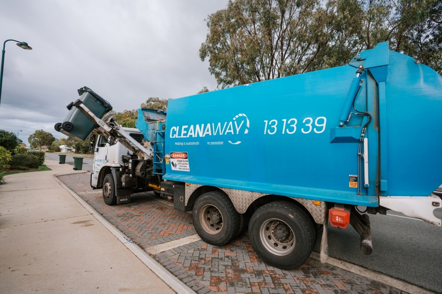 Cleanaway Rubbish Truck Cleanaway rubbish truck lifting a kerbside waste bin on a residential street