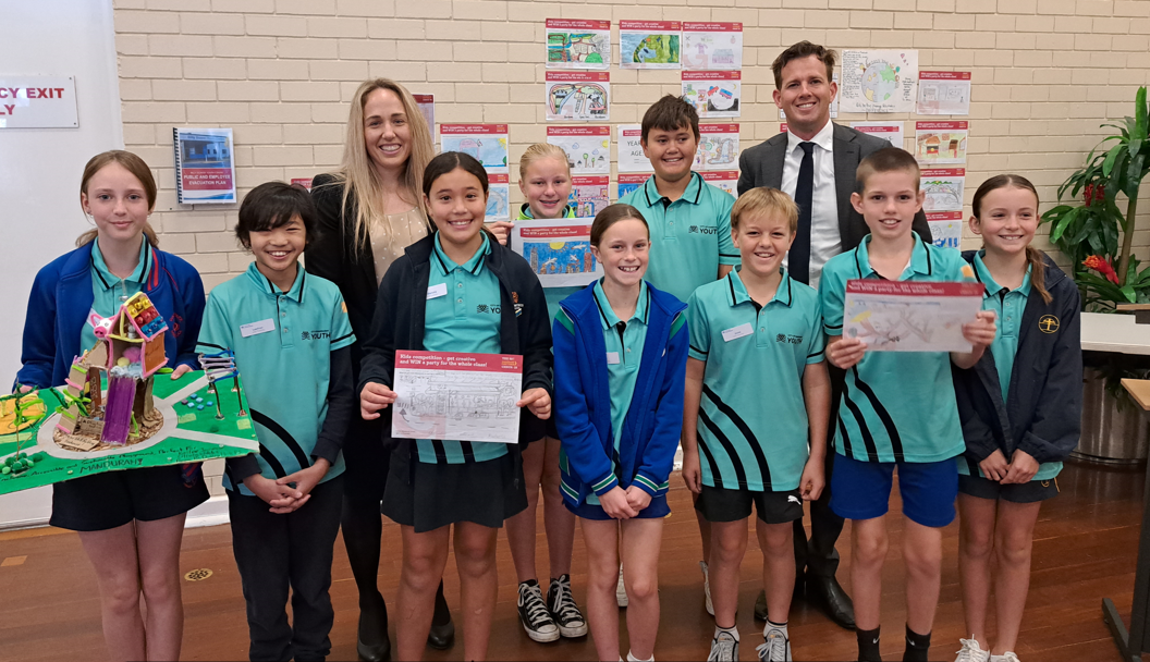 Mandurah Junior Councillors with winning artworks from the Big Check-in Kids Creative Competition, with Mayor Rhys Williams and CEO Casey Mihovilovich