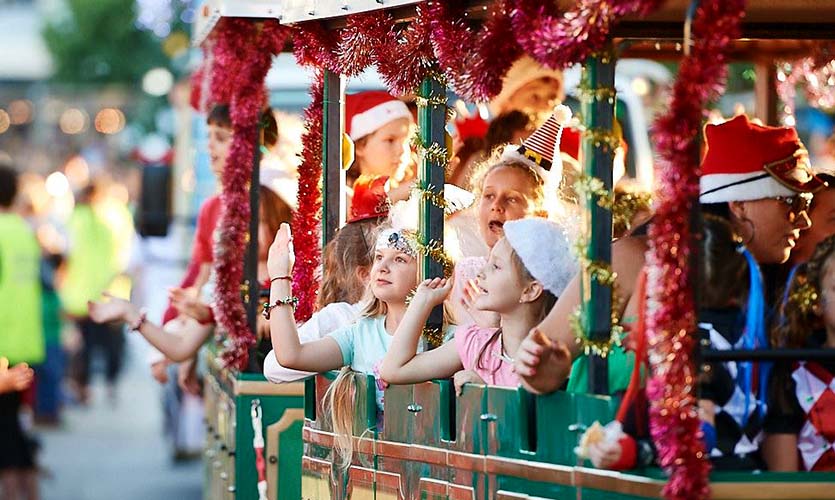 Kids sit on a Christmas train at Christmas Pageant