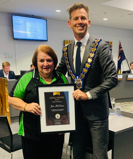 Local Legend Jan McGlinn and Mayor Rhys Williams stand side by side with certificate