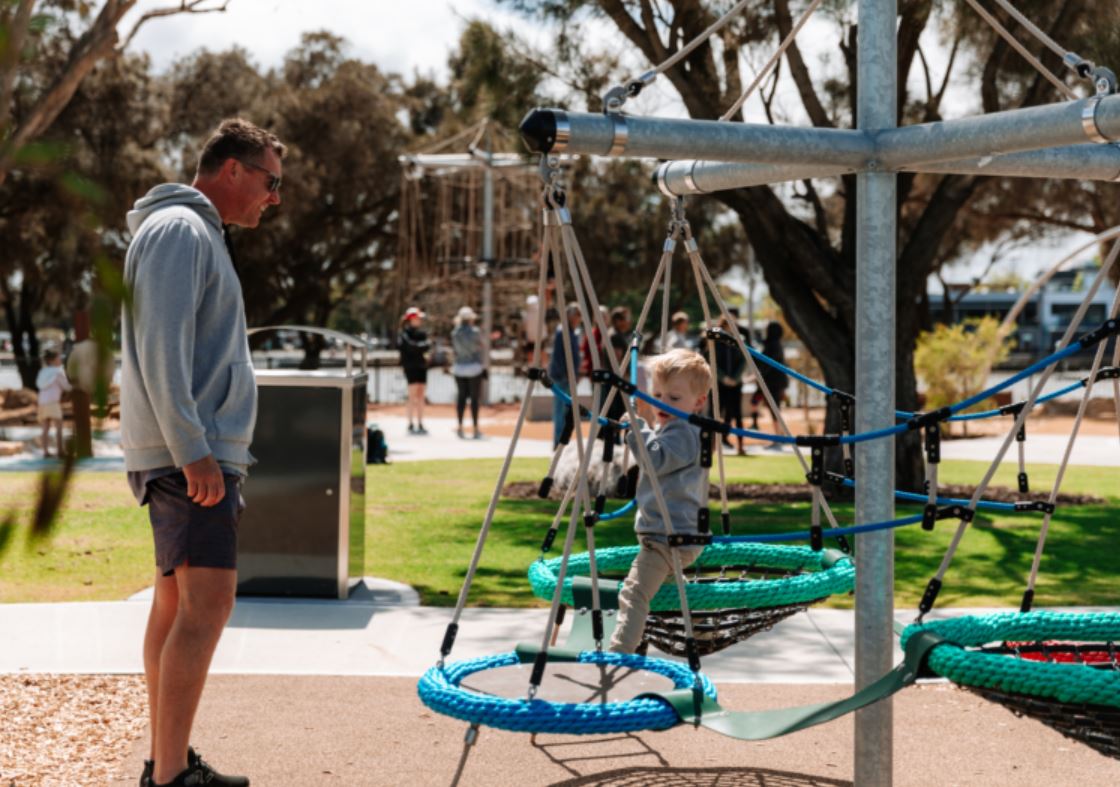 father and son at playground