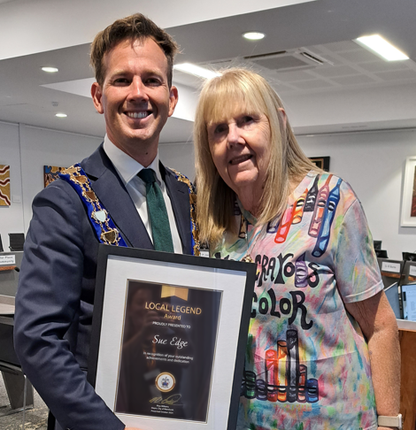 Mayor Rhys Williams stands beside Sue Edge with certificate