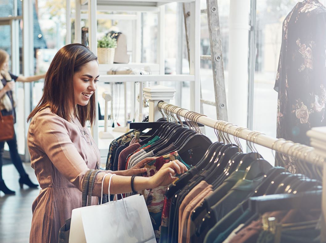 Woman browsing clothing racks