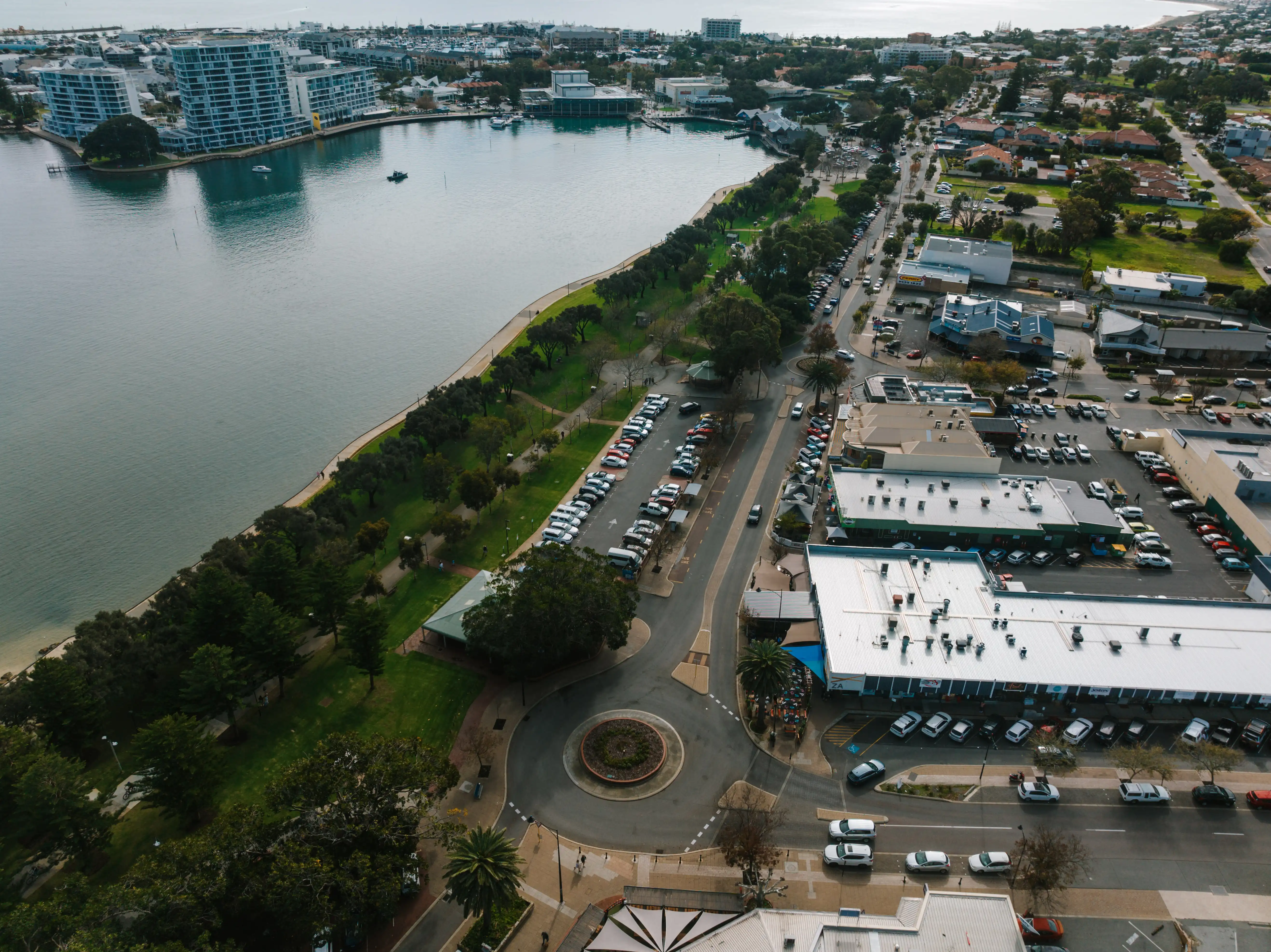 Aerial view of busy street beside body of water