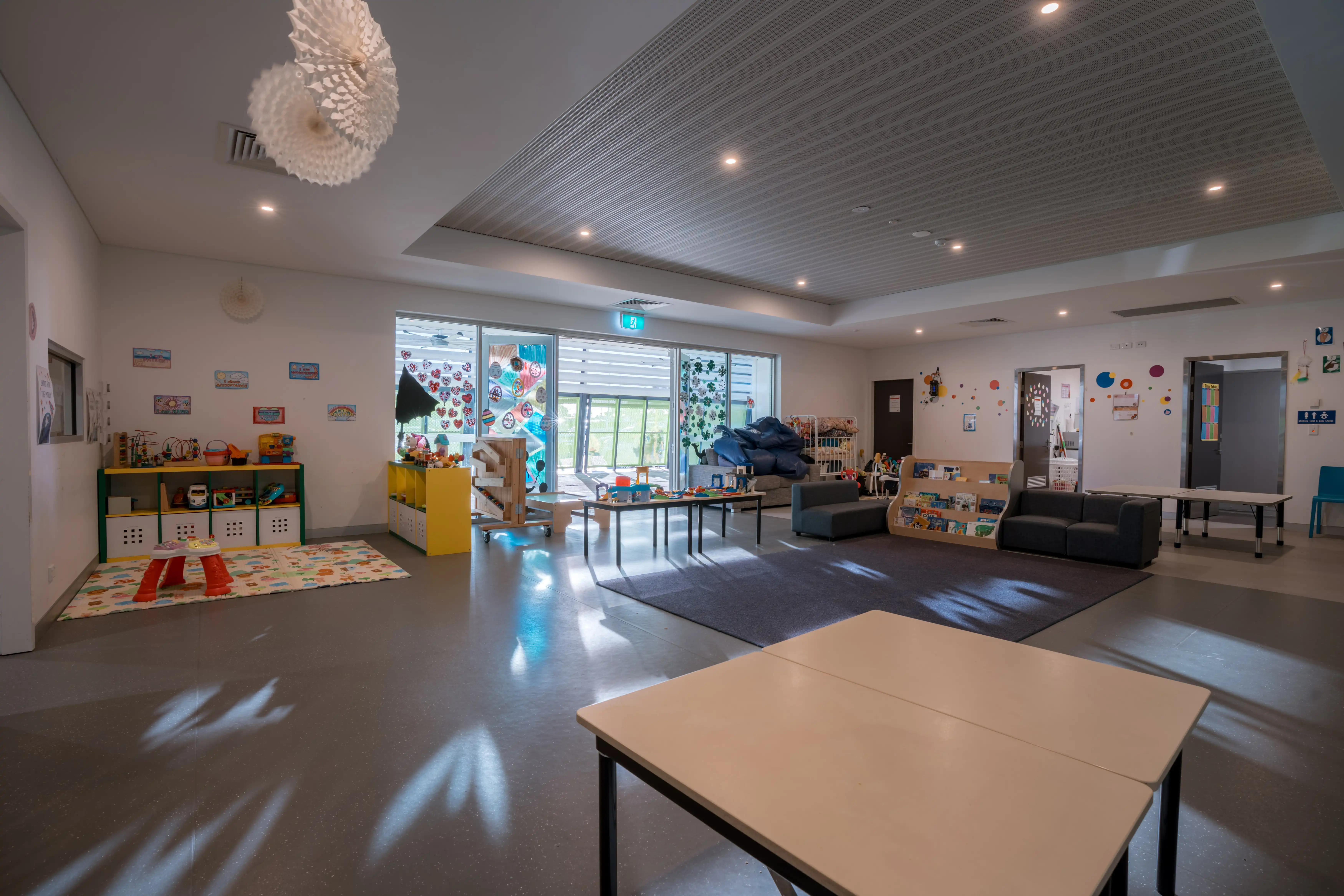 Bright indoor activity area inside the MARC crèche.